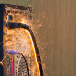 Sparks on the back of a computer as it overheats