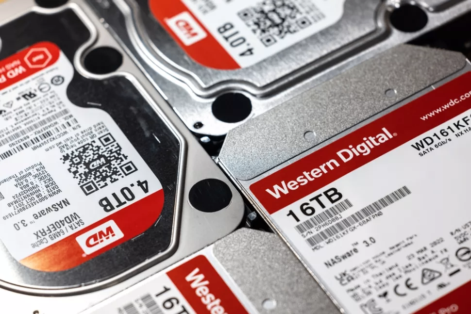 A close-up shot of four Western Digital WD Red SMR hard drives in 16TB and 4.0TB