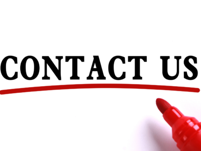 Contact us written in a white paper with a marker