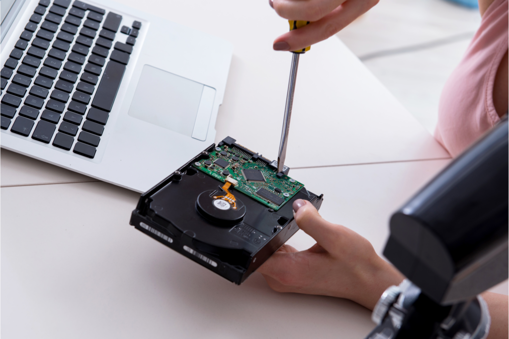 A technician recovering lost data from a bad hard drive