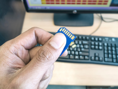 A business man holding an SD card
